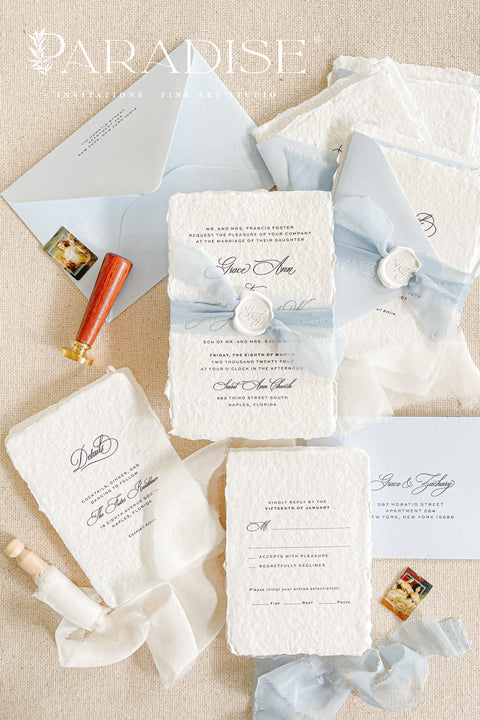 Announce your special day with a touch of coastal elegance and bohemian chic with this unique beach wedding invitations suite. Perfect for a seaside celebration, this elegant wedding stationery set combines classic details with a relaxed feel. Each invite is finished with a personalized wax seal, adding a luxurious, tactile element that makes a memorable first impression.