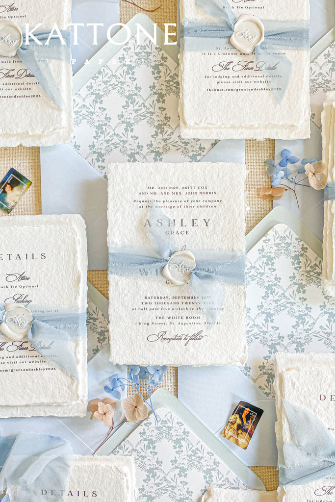Collection of wedding invitations and stationery items, assembled with silk ribbons and wax seals. envelope liners. Elevate your special day with our Briseis Handmade Paper Wedding Invites. Crafted with love and attention to detail, these elegant invitations blend rustic charm with modern design. Each piece is made from eco-friendly materials, ensuring a unique touch for your celebration. Perfect for intimate gatherings or grand affairs, our invites set the tone for your wedding.
