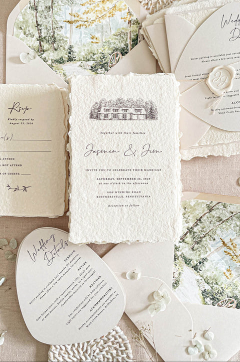 Luxury handmade paper wedding invitation suite featuring deckled edge cotton paper, custom scenic envelope liners, arch-shaped details cards, soft neutral envelopes, and romantic fine art wedding stationery styling.