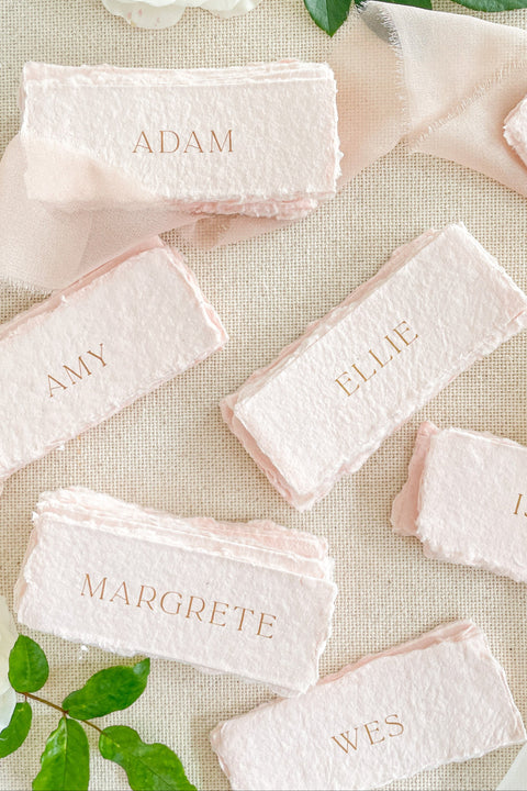 Elevate your table setting with our colored handmade paper place cards, beautifully crafted from premium cotton rag paper and finished with soft, natural deckled edges. Their delicate blush tones and elegant typography add a refined, romantic touch to weddings, dinner parties, and luxury events. Perfectly artisanal and customizable, these place cards bring warmth, texture, and timeless charm to every tablescape.