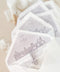Handmade paper envelopes with hand-drawn envelope liners styled with silk ribbon, soft lighting, and fine art wedding stationery details.