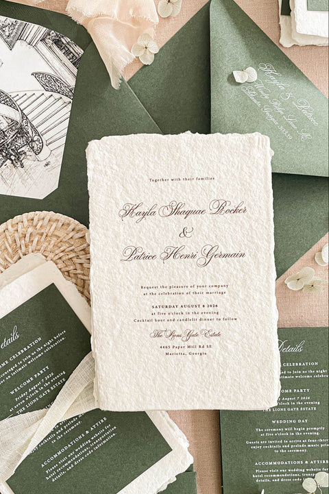 Luxury handmade paper wedding invitation suite featuring deckled edge cotton paper, deep green envelopes, elegant calligraphy typography, and custom venue illustration for sophisticated wedding stationery.