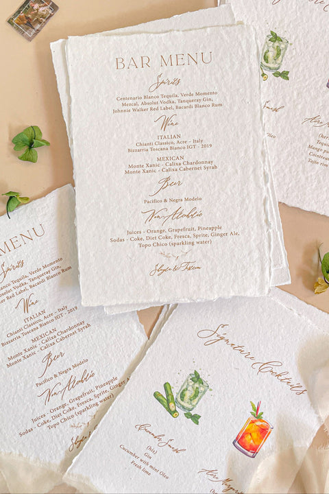 Bring artisanal charm to your celebration with our handmade paper bar menus, crafted on soft cotton paper with natural deckled edges. Each menu features elegant typography and delicate watercolor cocktail illustrations - perfect for adding a refined yet playful touch to your wedding bar or reception table. Designed for couples who love artistry, texture, and timeless elegance, these menus make your drink display truly unforgettable.