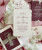Luxury handmade cotton paper wedding invitation with deckled edges styled with burgundy details cards, sage silk ribbon and botanical watercolor envelope liners.