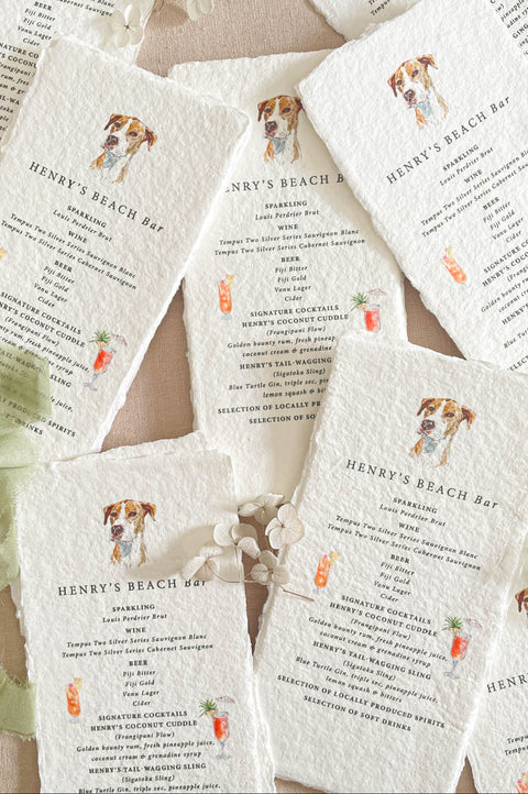 Handmade cotton paper wedding bar menus with deckled edges, featuring custom pet illustration and hand-painted cocktail icons.