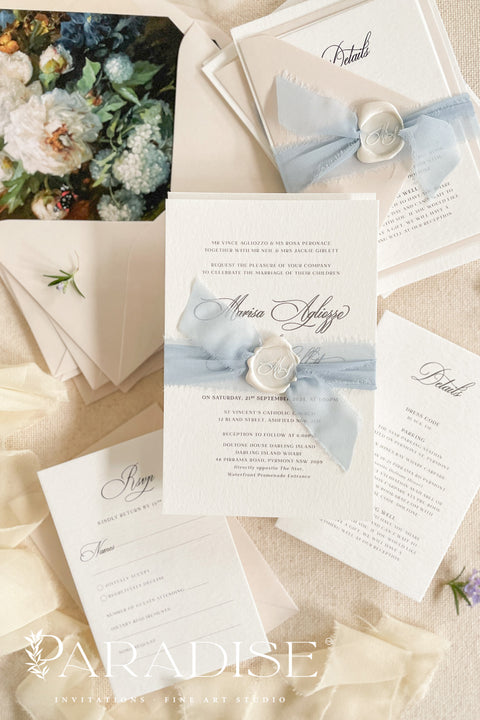 Add timeless sophistication to your wedding with our handmade wedding invitations featuring a dusty blue ribbon - a design that perfectly balances romance, elegance, and artisanal detail. Each invitation is handcrafted with care, combining fine-quality materials, soft neutral tones, and a touch of modern luxury that sets the tone for your unforgettable day.