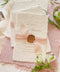 Announce your wedding day with effortless elegance through our handmade paper Save the Date cards, a perfect blend of romance and artisanal craftsmanship. Printed on luxury 100% cotton paper with soft deckled edges, each piece is wrapped in a delicate blush silk ribbon and finished with a hand-pressed wax seal, creating a timeless keepsake that captures the essence of fine-art stationery.