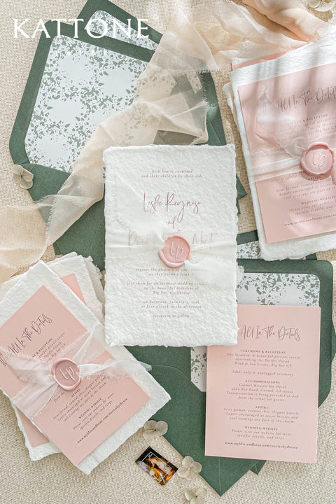 This handmade paper wedding invitation suite blends timeless artistry with modern charm. Each piece is printed on luxurious cotton handmade paper with natural deckled edges - creating a tactile, organic feel that speaks of care, craftsmanship, and love. Blush pink tones pair beautifully with rich forest green accents, offering a perfect balance of warmth and sophistication.