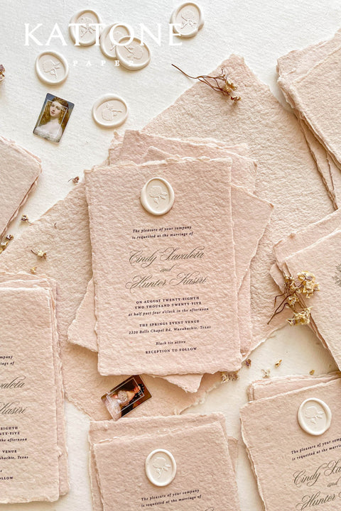 Elevate your wedding with our exquisite Handmade Paper Wedding Invitations featuring beautiful deckled edges. Crafted with love and attention to detail, these elegant invitations are tied together with luxurious silk ribbon, adding a touch of sophistication to your special day. Each piece is uniquely handmade, ensuring your announcements are as one-of-a-kind as your love story.