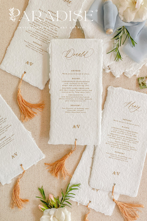 Elevate your table styling with our handmade paper wedding menus with tassels, where timeless craftsmanship meets modern sophistication. Each menu is hand-torn from 100% cotton rag paper, featuring natural deckled edges, elegant typography, and a custom tassel accent that adds texture, movement, and warmth to your table setting. Perfect for bohemian, Mediterranean, or fine art-inspired weddings, these menus combine old-world artistry with contemporary luxury.