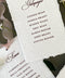 Handmade paper wedding place cards with deckle edges and elegant guest name typography.