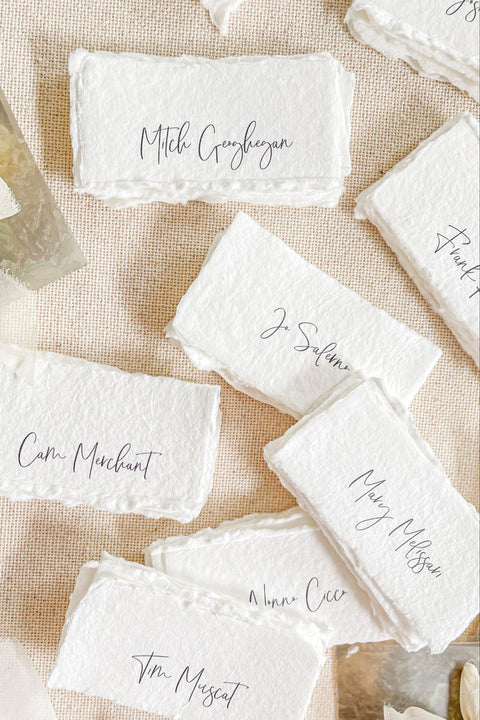 Bring timeless elegance to your event with our handmade paper place cards, crafted from luxurious cotton rag paper and finished with natural deckled edges. Each card features modern calligraphy and an organic fine-art texture, making them perfect for weddings, intimate dinners, bridal showers, or upscale celebrations. These artisan-crafted cards add softness, sophistication, and a beautifully refined touch to any tablescape.