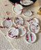 Add a romantic, handcrafted finishing touch to your stationery with these ivory botanical wax seals, delicately adorned with pressed rose petals. Each seal is individually poured and stamped, creating soft organic edges and subtle variations that enhance their artisanal character. Designed to elevate wedding invitations, envelopes, menus, and keepsakes, these wax seals bring timeless elegance and floral warmth to fine-art paper goods.