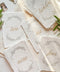 Soft floral wreaths and handcrafted deckle-edge cotton paper come together to create table numbers with a refined, organic aesthetic. The flowing gold script adds warmth and sophistication, while the botanical detailing enhances the romantic, fine-art charm. Perfect for garden weddings, outdoor celebrations, and naturally inspired décor, this design brings a delicate, timeless touch to every table.