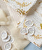 Add a delicate, nature-inspired finish to your stationery with these handcrafted botanical wax seals. Featuring a soft ivory base with pressed floral detailing, each seal brings an organic, romantic touch that feels timeless and elevated. Perfect for fine art wedding invitations, vow books, envelopes, and keepsake packaging, these wax seals pair beautifully with handmade paper, silk ribbon, and gold-accented designs.