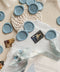 Elevate your stationery with these handcrafted dusty blue wax seals, designed to add a soft, timeless accent to fine art invitations. Each seal is individually poured and stamped with a classic monogram, creating a refined detail that feels elegant, tactile, and intentionally made. The muted blue tone pairs beautifully with handmade paper, silk ribbons, and neutral palettes, making these wax seals a perfect finishing touch for weddings and bespoke paper goods.