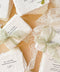 Add refined, old-world elegance to your event with our handmade paper place cards, crafted from luxurious cotton rag paper and finished with naturally torn deckled edges. Each card features elegant serif typography and optional soft green ribbon, creating a timeless fine-art aesthetic perfect for weddings, rehearsal dinners, and sophisticated celebrations. Their artisanal texture, organic silhouette, and customizable details bring beauty and authenticity to every tablescape.
