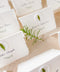 Add an organic, fine-art touch to your event with our handmade paper place cards, crafted from luxurious cotton rag paper with naturally torn deckled edges. Each card features a white botanical wax seal embedded with a real leaf, paired with elegant calligraphy for a soft, romantic aesthetic. Perfect for weddings, garden celebrations, and refined gatherings, these artisan-crafted place cards bring natural beauty and timeless charm to any tablescape.