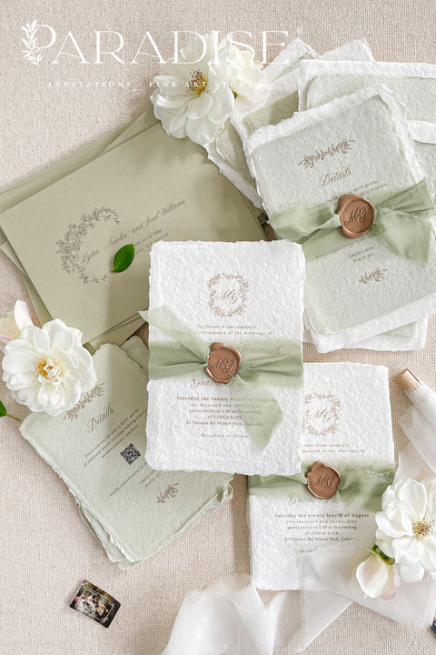 This exquisite wedding invitations suite offers a blend of natural elegance and modern romance. Perfect for a green summer wedding, these invitations are printed on luxurious handmade paper, which provides a rich, tactile feel. The elegant modern calligraphy design adds a touch of contemporary sophistication, setting a fresh and heartfelt tone for your special day.