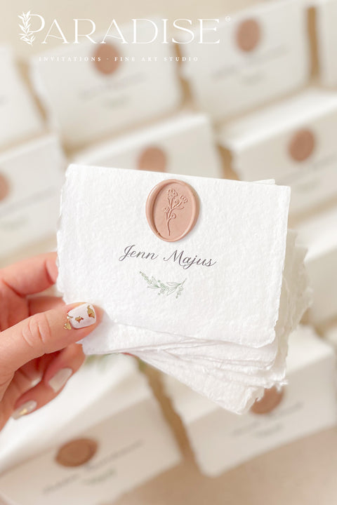 Add refined elegance to your event with our handmade paper place cards, crafted from luxurious cotton rag paper and finished with soft deckled edges. Each card features elegant calligraphy paired with a blush wax seal, creating a timeless and romantic detail for weddings, dinners, and fine-art celebrations. These artisan place cards bring texture, charm, and sophistication to any tablescape.