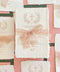 Christian baptism invitation printed on handmade cotton paper with floral cross design and blush silk ribbon.