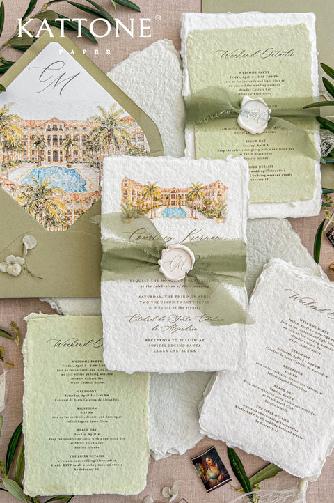 Overhead flat lay of a luxury sage green wedding invitation suite featuring white deckled handmade paper, watercolor tropical resort illustration, olive green envelopes with illustrated liners, matching weekend details cards, silk ribbon and ivory monogram wax seals.