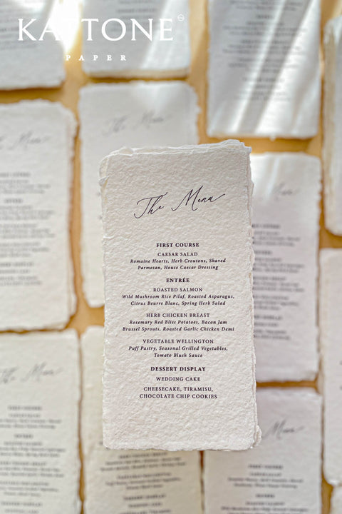 Elevate your tablescape with our handmade paper wedding menus, meticulously crafted from luxury cotton paper with naturally torn deckled edges. Each piece exudes timeless refinement - perfect for romantic, fine-art, or destination weddings. Featuring minimalist typography and soft organic texture, these menus create a cohesive, elegant setting that beautifully complements your stationery suite and enhances your guests’ dining experience.