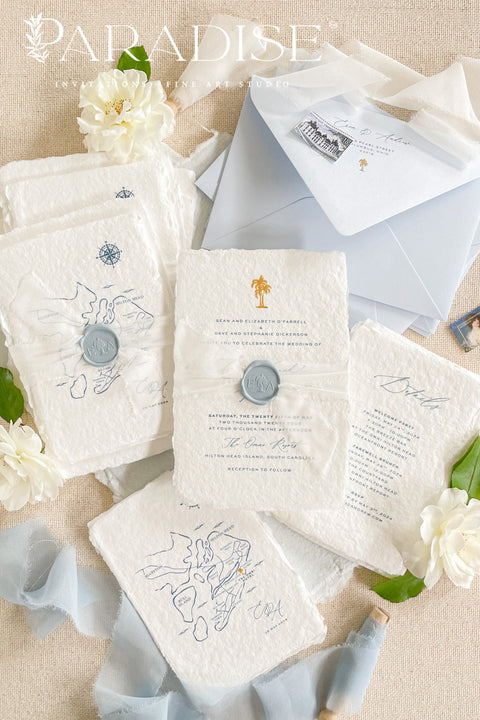 Announce your seaside celebration with these beautifully crafted handmade paper wedding invitations. Perfect for a beach wedding, this suite combines a relaxed, coastal feel with the refined elegance of artisan cotton rag paper. Each invitation features a delicate botanical design that evokes the natural beauty of the shoreline, from swaying palms to coastal foliage.