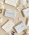 Add a touch of fine-art elegance to your celebration with our colored handmade paper place cards, crafted from premium cotton rag paper and finished with soft, natural deckled edges. Each card features beautifully flowing calligraphy and comes in a curated palette of soft, romantic hues - perfect for weddings, dinner parties, bridal showers, or luxury events. Designed to elevate any tablescape, these artisanal place cards bring warmth, texture, and timeless beauty to your seating arrangements.
