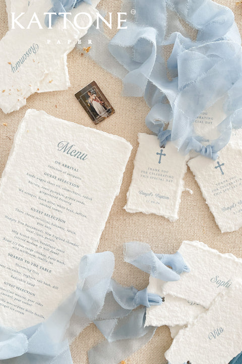 Thoughtfully crafted from handmade paper, these thank you cards offer a beautifully tactile way to express gratitude after a meaningful celebration. Featuring soft deckled edges, calming blue typography, and delicate chiffon ribbon details, each card feels timeless, serene, and deeply personal. Ideal for christenings, baptisms, weddings, or elegant gatherings, these cards blend artisanal craftsmanship with understated elegance, creating a keepsake your guests will truly cherish.