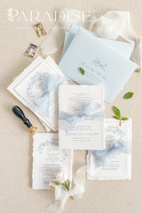 Announce your special day with timeless, heartfelt style. This botanical wedding invitation suite is crafted on our signature, luxurious handmade paper, made from 100% recycled cotton rag. The unique deckled edges and soft texture provide an artisan feel that is both rustic and elegant, setting a deeply romantic tone for your ceremony. Featuring delicate botanical illustrations, each invite is an eco-friendly choice that leaves a lasting impression on your guests.