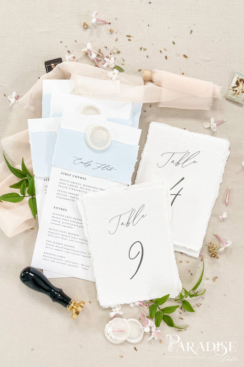 Handmade Elegance. Elevate your reception décor with these artisan-crafted handmade paper table numbers. Soft deckled edges, fine-art texture, and minimalist calligraphy create a timeless, romantic look that pairs effortlessly with classic, coastal, or garden-inspired weddings. Luxury cotton paper brings a natural tactile charm, while the clean design ensures easy visibility for guests. Perfect for styled tablescapes, flat-lays, and capturing beautiful detail photos that complete your event aesthetic.