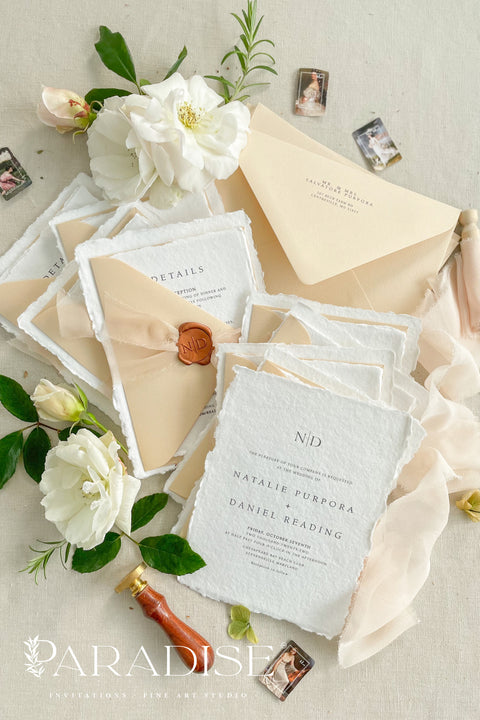 Simple, elegant, and timeless - our handmade wedding invitation suite is crafted from luxury cotton paper with naturally torn deckled edges, giving each piece a soft, organic texture. Paired with beige envelopes, blush silk ribbon, and a classic bronze wax seal, this design captures understated sophistication and effortless romance.