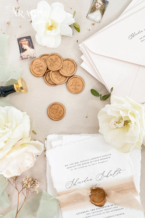 Elegant wax seals designed to elevate your wedding stationery with timeless detail. Each seal is hand-poured and finished to add a refined, heirloom-quality touch to envelopes, invitations, and day-of paper goods. Perfect for couples seeking a classic, romantic aesthetic with artisanal craftsmanship. Ideal for wedding invitations, save the dates, vow books, menus, and keepsake correspondence, these wax seals bring a sense of tradition and luxury to every detail.
