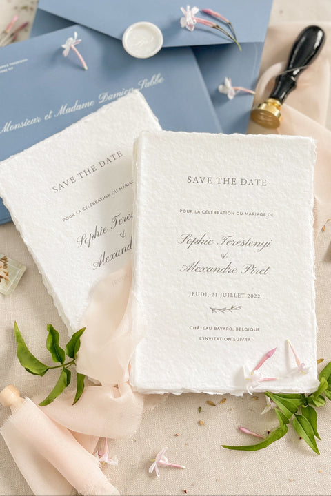 Announce your wedding with timeless simplicity through our handmade paper Save the Date cards, crafted from 100% cotton paper with elegant deckled edges and minimalist typography. Designed to embody effortless refinement, this piece celebrates the beauty of fine craftsmanship and understated romance - perfect for couples who appreciate modern elegance with artisanal charm.