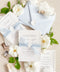 This exquisite invitation sets suite offers a blend of modern sophistication and natural beauty. Perfect for a beach wedding, these personalised invites feature a stunning, modern clean calligraphy design printed on luxurious handmade cotton paper. The tactile, rich feel of the paper beautifully complements the elegant and contemporary typography, setting a fresh and personal tone for your special day.