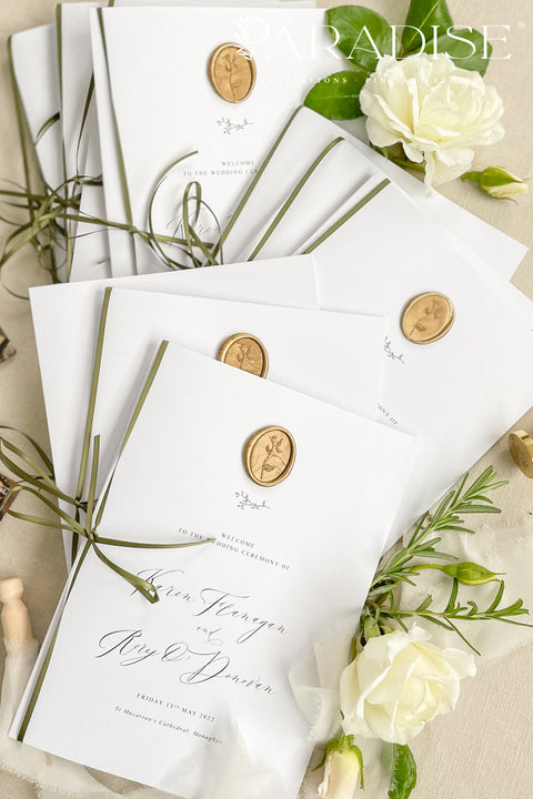 This wedding program is thoughtfully designed with clean typography, soft white cardstock, and an olive green ribbon tied by hand for a naturally elegant finish. A warm gold wax seal adds a touch of old-world charm, creating a harmonious blend of modern minimalism and classic detail. Perfect for couples who want a quiet, graceful aesthetic, this program offers a polished way to present your ceremony with style and intention.