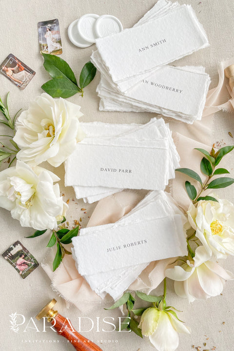 Add refined simplicity to your event with our handmade paper place cards, crafted from premium cotton rag paper and finished with naturally torn deckled edges. Each name tag features minimalist printed lettering and a soft fine-art aesthetic, making them perfect for weddings, rehearsal dinners, intimate gatherings, and elegant celebrations. These artisan-crafted cards bring understated beauty, organic texture, and timeless charm to any tablescape.