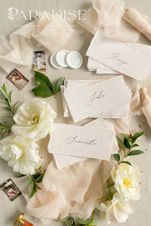 Elevate your event with our handmade paper place cards, crafted from luxurious cotton rag paper and finished with naturally torn deckled edges. Each name tag features elegant calligraphy and a soft fine-art aesthetic, making them ideal for weddings, intimate dinners, bridal showers, and high-end celebrations. These artisan-crafted cards bring refined texture, timeless charm, and a beautifully romantic look to any tablescape.