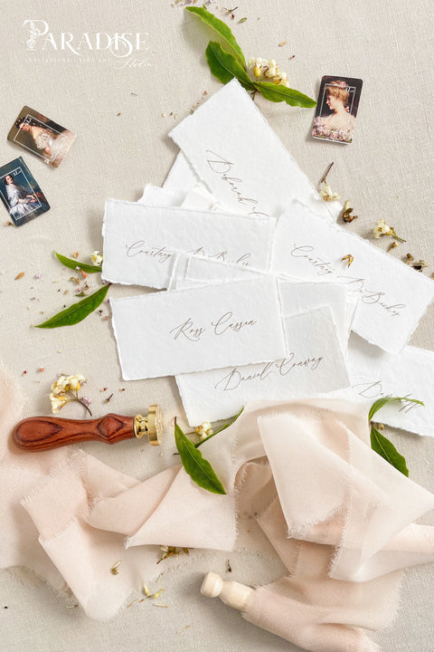 Create a timeless, romantic tablescape with our handmade paper place cards, crafted from luxurious cotton rag paper and finished with natural deckled edges. Each piece features elegant handwritten calligraphy and a soft fine-art texture that complements weddings, intimate dinners, bridal showers, and elevated celebrations. Their artisanal character and organic feel bring warmth, refinement, and delicate charm to any event setting.