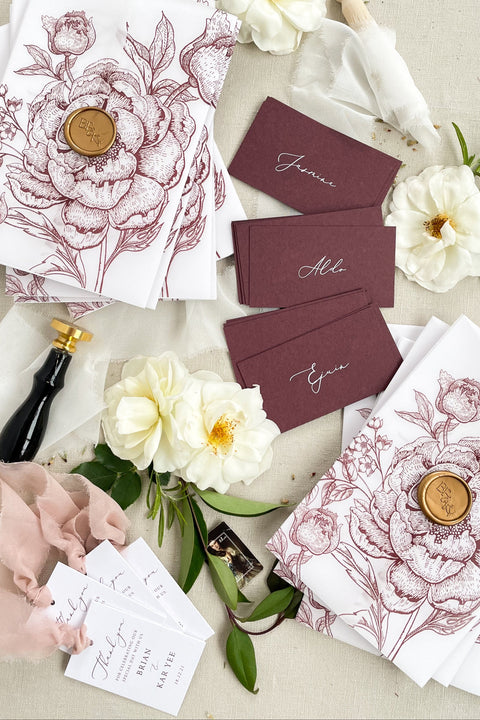 Make a bold, refined statement with our burgundy place cards, designed from premium heavyweight cardstock and finished with elegant calligraphy. Their rich, deep color adds dramatic sophistication to weddings, rehearsal dinners, galas, and modern celebrations. Whether styled with fine-art florals or paired with minimalist décor, these place cards bring effortless luxury, contrast, and warmth to any tablescape.