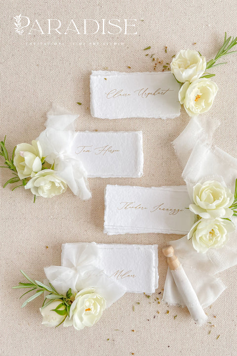 Create a romantic, fine-art tablescape with our handmade paper place cards, crafted from luxurious cotton rag paper and finished with soft, torn deckled edges. Each card features elegant calligraphy, delicate chiffon ribbon, and a timeless organic texture - perfect for weddings, intimate dinners, bridal showers, or upscale celebrations. These artisan-crafted pieces bring softness, refinement, and natural beauty to any seating display.