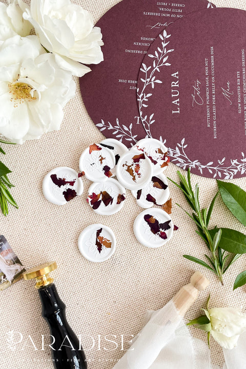 Designed to elevate envelopes, invitations, and keepsakes, these handcrafted wax seals add a refined finishing touch to wedding stationery, celebration suites, and luxury correspondence. Each seal is individually poured and finished with delicate botanical accents, creating subtle variation and an heirloom-quality look that feels both romantic and timeless. Perfect for weddings, bridal showers, baptisms, and fine-art paper goods.