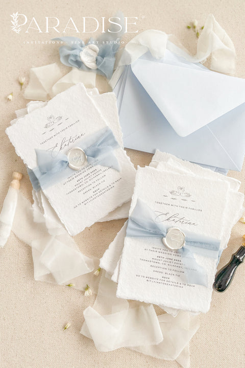 Delicate, timeless, and effortlessly romantic - this handmade paper wedding invitation suite is the perfect blend of fine art elegance and heartfelt simplicity. Printed on luxury deckled-edge cotton paper, each invitation exudes artisanal charm, its softly torn edges and tactile texture embodying the beauty of handcrafted design. Tied with a dusty blue silk ribbon and sealed with a white wax monogram, this suite radiates an ethereal calm - a whisper of something classic and pure.