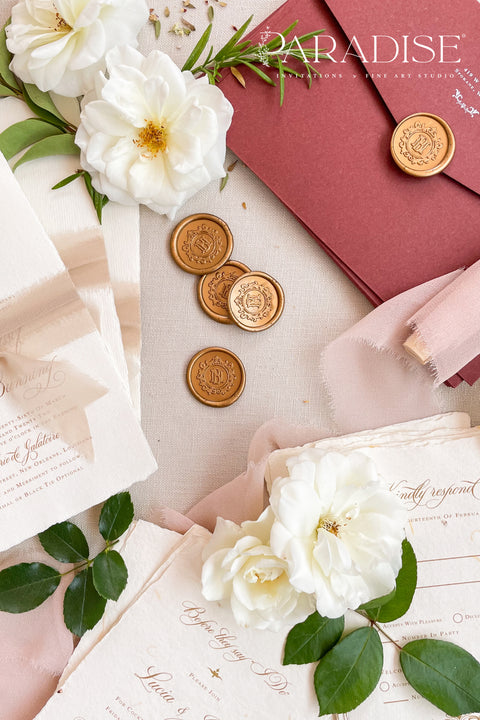 Golden wax seals bring a warm, timeless elegance to your wedding stationery, adding a luxurious finishing touch to envelopes, invitations, and keepsakes. Hand-poured with care, each seal features a rich golden tone that catches the light beautifully, creating a refined detail that feels both classic and romantic. Perfect for weddings, bridal showers, christenings, and fine-art paper suites, these wax seals elevate every piece they adorn.