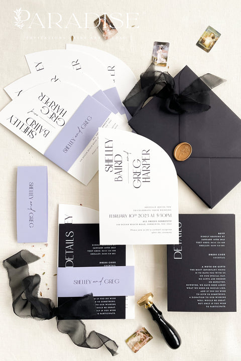 Contemporary, bold, and beautifully refined - our half arched wedding invitation suite is the perfect choice for couples who adore modern minimalism with an editorial twist. Crafted with precision on luxury matte cardstock, each suite pairs black and white invitations with lavender details, arched silhouettes, and a black chiffon ribbon tied in a soft bow. The combination of elegant typography and structural design creates a clean, modern aesthetic ideal for urban, modern-romantic, or black-tie weddings.