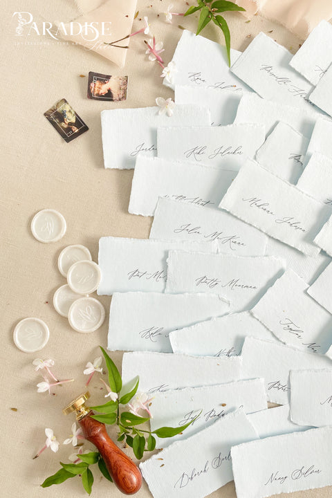 Add soft color and fine-art elegance to your event with our colored handmade paper place cards, crafted from luxurious cotton rag paper and finished with naturally torn deckled edges. Each card features refined calligraphy and a subtle organic texture, creating a beautifully romantic detail perfect for weddings, showers, rehearsal dinners, or elevated celebrations. Their artisanal feel and pastel tones bring charm, sophistication, and warmth to any tablescape.