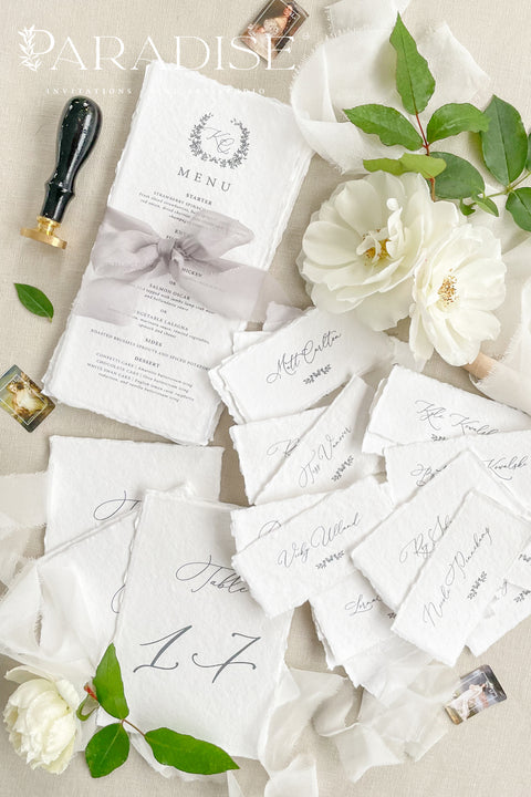 Bring timeless elegance to your event with our handmade paper place cards, crafted from luxurious cotton rag paper and finished with naturally torn deckled edges. Each name tag features refined calligraphy and a soft fine-art aesthetic, making them perfect for weddings, rehearsal dinners, intimate gatherings, and upscale celebrations. These artisan-crafted cards add texture, beauty, and sophistication to any seating display or tablescape.