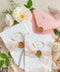 Announce your wedding with elegance and artistry through our handmade paper Save the Date cards, featuring a gold monogram wreath, soft blush silk ribbon, and hand-stamped wax seal. Each card is crafted on luxury 100% cotton handmade paper with deckled edges, offering a tactile and romantic texture that perfectly captures fine-art wedding style.