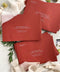 Red wedding envelopes with professional address printing, crafted from premium paper and arranged to show clean edges, rich color, and elegant typography.